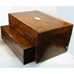 A mid 19th century burr walnut sewing and writing box, the rectangular hinged lid cross banded in k.