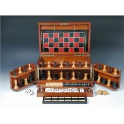 A late Victorian mahogany games compendium, the rectangular hinged lid containing leather games boa.