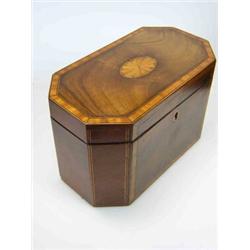 A George III mahogany tea caddy, the canted rectangular lid satinwood cross banded about central ova