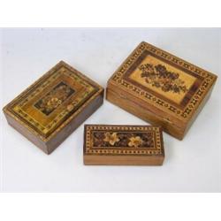 Three Tunbridge ware boxes, each with floral inlaid tops, one with lift up lid containing playing c.