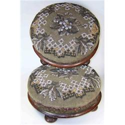 A pair of beadwork mahogany footstools, the floral covers of the stuffed tops fixed to the mahogany.