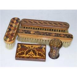A collection of five Tunbridge wares, to include three clothes brushes, rectangular paper weight in.