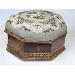 A Victorian walnut footstool box, the floral bead work lid hinged to an octagonal base inlaid with..