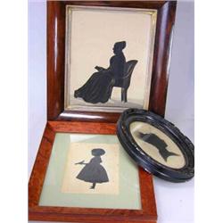 Samuel Metford, a silhouette of a lady seated holding a book, the details in gilt, within rosewood f