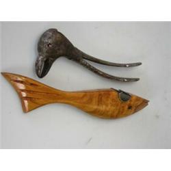 A pair of cast iron nutcrackers in the form of a bird's head and beak, its gilt eyes reddened, 16cm.