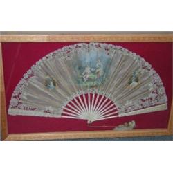 A framed 19th century French fan painted by I Ostolle with oval portraits of a man and woman flanki.