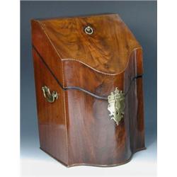 A George III mahogany knife box, the sloping and serpentine fronted lid closing on ebony fillet, th.