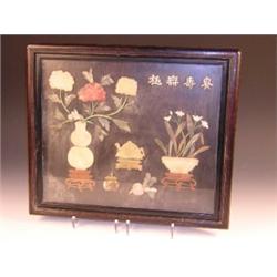 A 20th century provincial Chinese hardstone picture of flowers in a vase and bowl flanking teapot a.