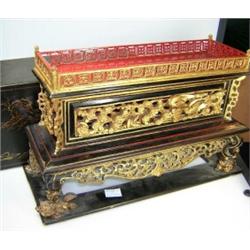 A 19th century Chinese lacquered wood temple box, the rectangular lid lifting off to reveal a galle.