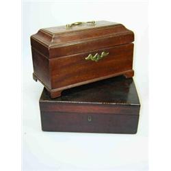 A George III mahogany tea caddy the brass handle to the rectangular lid raised above cavetto band,..