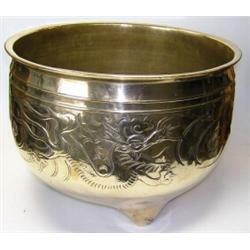 An early 20th century Chinese polished bronze planter, the rounded cylindrical sides chased with a..