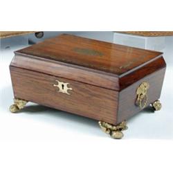 An early 19th century brass inlaid rosewood box, the rectangular lid hinged to a sarcophagus shaped.