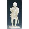 Image 1 : An early 20th century Japanese ivory and shark's tooth figure of a man standing holding a paddle in.