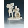 Image 1 : An early 20th century Japanese ivory and shark's tooth group of two workmen, one standing holding a.