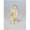 Image 1 : An early 20th century Japanese shark's tooth figure, carved as a man holding a bird and a bag of fo.