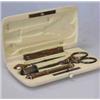 Image 1 : A 19th century French ivory etui, the rounded rectangular case containing silver gilt needle case,..