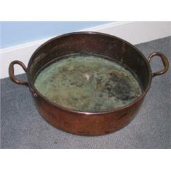 A 19th century copper preserve pan, the shallow cylindrical shape with brazed seams and brass handl.