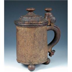 A Norwegian peg tankard, dated 1761,  a knob finial central to a carved rope band on the hinged dom.