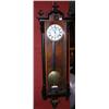 Image 1 : A weight driven Vienna regulator wall clock, the finial mounted arched cornice above a long glazed d