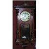 Image 1 : A spring driven Vienna wall clock, the moulded cornice above a glazed door enclosing a white enamel.