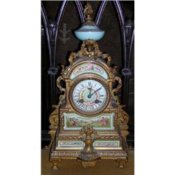 Parros Freres. A late 19th century French gilt metal and porcelain mounted mantel clock, the pale bl