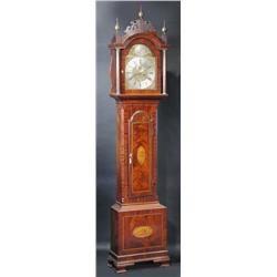 An 18th century mahogany cased eight day longcase clock, the finial mounted pierced pediment above..