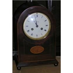 An Edwardian mahogany and inlaid dome top mantle clock, the enamel dial marked 'Examined by Clerke..