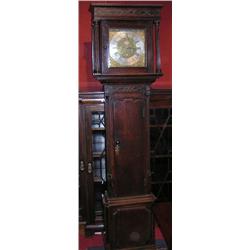 An 18th century oak cased longcase clock, the moulded cornice with blind fret worked frieze above a.