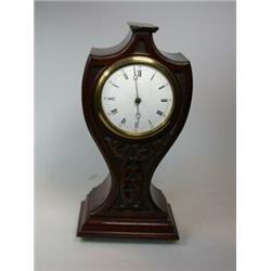 An early 20th century mahogany balloon clock, the eight day movement with platform escapement, the c