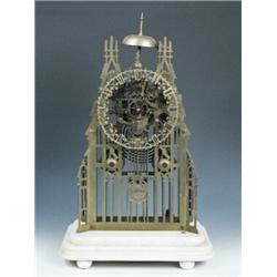H Palmer Birmingham. A Victorian brass skeleton clock, the cathedral-type open frame with twin spir.
