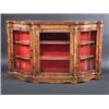 Image 1 : A Victorian figured walnut credenza, the moulded shaped top above a marquetry inlaid and ormolu mou.