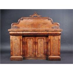 A Victorian mahogany sideboard, the upper section with scroll carved shaped solid back above a rect.