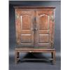 Image 1 : An 18th century oak cupboard on stand, the upper section with moulded cornice above a pair of arch p