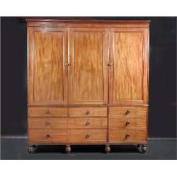 A Regency mahogany linen press, the upper section with reeded moulded cornice above a pair of panell