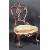 Image 1 : A Victorian single chair, the shaped back naturalistically carved above an overstuffed seat, standi.