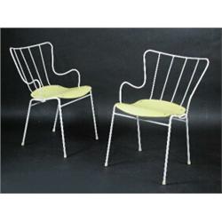 A pair of Ernest Race Antelope chairs, each with solid yellow seat (2)  £120-180...