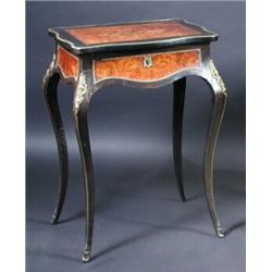 A 19th century continental ebonised serpentine pedreuse, the ormolu mounted burr wood inset marquet.