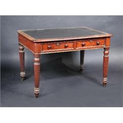 A Regency mahogany library table, the rounded rectangular top with inset writing surface, above two.