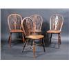 Image 1 : A Set of three yew wood and elm wheelback Windsor chairs, with saddle shaped seats and turned legs..