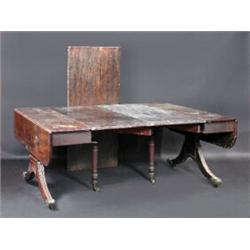 A good Regency mahogany concertina action dining table, the drop flap top with three leaf insertion.