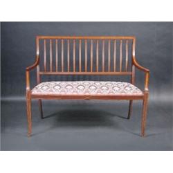 An Edwardian mahogany parlour settee, the satinwood crossbanded back above downswept arms and sprun.