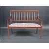 Image 1 : An Edwardian mahogany parlour settee, the satinwood crossbanded back above downswept arms and sprun.