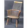 Image 1 : A 19th century ash and elm primitive comb back Windsor chair, the bowed top rail above a spindle ba.