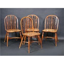 A set of four 19th century yew wood and elm Windsor chairs in the manner of Robert Prior of Uxbridg.