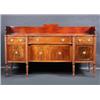 Image 1 : A Regency mahogany sideboard, the shaped top with reeded edge and solid three quarter gallery above.
