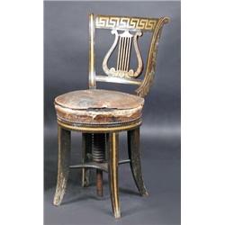 A Regency decorated harpist's stool, the bowed top rail above a pierced lyre back and leather cover.