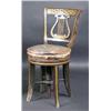 Image 1 : A Regency decorated harpist's stool, the bowed top rail above a pierced lyre back and leather cover.
