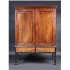 Image 1 : A George III mahogany cupboard on later stand, the upper section with moulded cornice above a pair..
