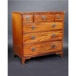 A George III mahogany chest, the rectangular crossbanded top above three short and three long drawe.