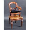 Image 1 : A Victorian mahogany child's high chair, the arched top rail above scrolling arms and drop in seat s